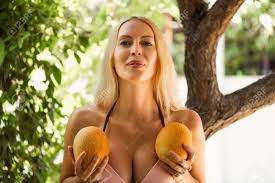 Beautiful Large Female Breasts. The Girl Is Holding Two Melons Near The  Chest Stock Photo, Picture and Royalty Free Image. Image 111564556.