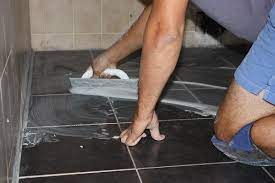 tiling a shower floor or wall first