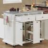 Sturdy rolling kitchen island with butcher block top and place for microwave and garbage can! 1