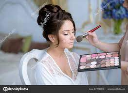 wedding makeup artist making a make up