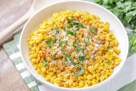 Elote is grilled corn that's slathered in a sauce of sour cream, mayonnaise, and chili powder, and sprinkled with cheese. Mexican Street Corn Torchy S Copycat Lil Luna