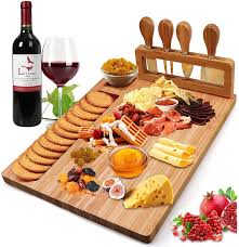 Some of these gifts even come with a wooden cheese board to put them on and cheese knives to cut them with. Amazon Com Bamboo Cheese Board Set Cheese Tray Charcuterie Board And Serving Meat Platter With 4 Stainless Steel Cheese Knives Ideal For Wedding Gifts Christmas Birthday Party 14 X11 Cheese Plates