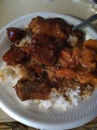 Pork Fingers in a gravy over hot steaming white rice with side of ...