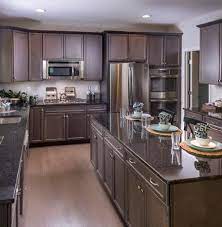 Kitchen cabinets, kitchen remodeling, bath cabinets, granite countertops, quartz countertops, kitchen design, factory cabinet pricing. Dark Style Kitchen Cabinets And Counters In Middletown Delaware Drhorton Findyourhome Kitchen Cabinet Styles Custom Kitchen Cabinets Kitchen Cabinets