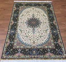 kashmiri silk black carpet and multi