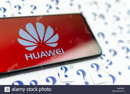 Huawei Logo On The Huawei Smartphone And A Lot Of Paper