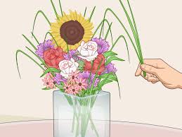 The vase itself is already large and medium vases usually have a wide opening and can fit many floral varieties. 3 Simple Ways To Arrange Flowers In A Vase Wikihow