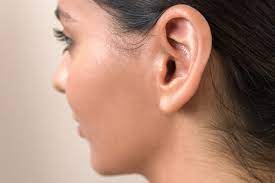 lump behind the ear causes and when to