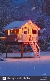 Childs Playhouse In Winter With Snow And Christmas Lights