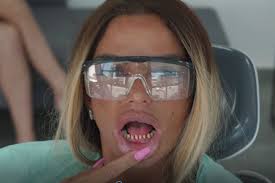 Katie price has shared a video of herself spitting out her old teeth as she had her veneers replaced while away in turkey recently. Katie Price Horrified As Fake Teeth Fall Out Just Weeks After Getting Veneers Leaving Her With Bond Villain Fangs