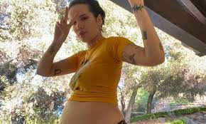 Halsey shows off her growing baby bump
