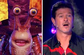 12 celebrity performers wear costumes to conceal identities. The Masked Singer Snail Reveal
