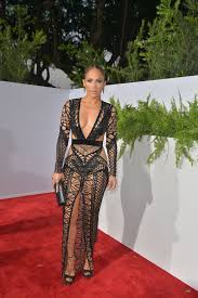 PICS Jennifer Lopez looks sensational in two barely there dresses.