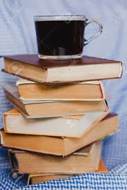 A Stack Of Books With A Coffee Mug In Close-up. Concept For World.. Stock  Photo, Picture And Royalty Free Image. Image 141411852.