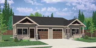 duplex house plan with garage in middle