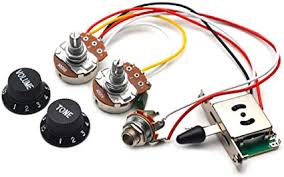 This is about connecting together the pieces that make an electric guitar. Amazon Com Getmusic Guitar Wiring Harness Set Prewired 500k Big Pots 5 Way Switch Wiring Harness Kit With 6 35 Output Black Knobs For Electric Guitar Musical Instruments