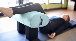 Restorative yoga enables deep relaxation as you holding poses for longer periods of time with the help of props to completely support you. Stonehenge Back Pain Relief Hugger Mugger