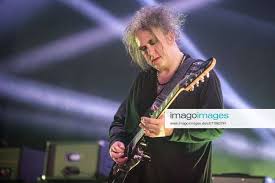 robert smith of the cure performs