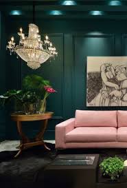 what colour sofas with dark green walls