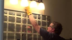 how to remove mirror glued to wall
