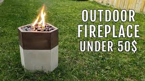 A fire pit should be built at least 15 feet from any structure and close to a water source. Diy Outdoor Fire Pit Fireplace Concrete And Wood Youtube