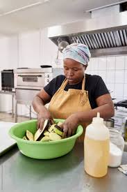 a female chef cook preparing food in a