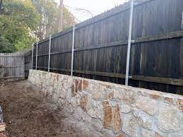 Milsap Stone Wall With New Cedar Fence