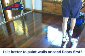 paint walls or sand floors first