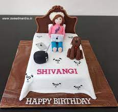 More similar cake designs for girls products. Bed Shaped Customized 3d Cake With Girl Sitting On Bed Having Laptop Pet Dog Music System Iphone Around For Her Birthday At Pun Cake Themed Cakes Girl Cakes