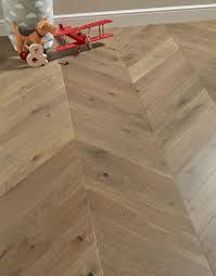Rustic wood flooring is all the rage but you don't have to go with real wood to get the same effect. Chelsea Chevron Urban Oak Brushed Lacquered Engineered Wood Flooring Direct Wood Flooring