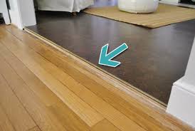 uneven wood and tile flooring