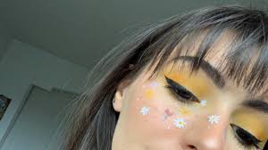 yellow eye makeup flower freckles