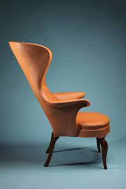 high backed wing chair designed by