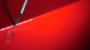 exposes scratched paintwork panel gaps