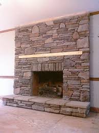 dry stack over a drab brick fireplace