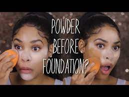 applying powder before foundation