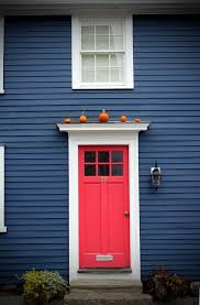red door house exterior blue