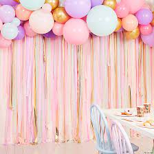 gold crepe paper streamer backdrop with
