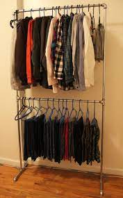 (i hear exercise equipment makes a great clothes rack) Diy Pipe Clothing Rack