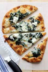 flatbread pizza with spinach and goat
