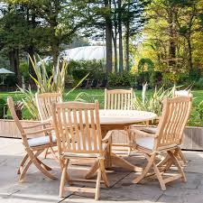 Beautiful and solid wood legs with clear and clean texture, combined with the design inspiration of the medieval modern style. Roble 6 Seat Bengal Pedestal Round Garden Table Set Folding Carvers Oatmeal Riverhill Garden Supplies