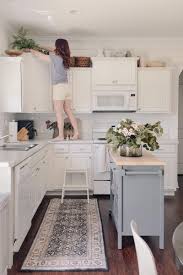 how to decorate above kitchen cabinets