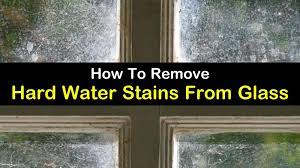 remove hard water stains from glass