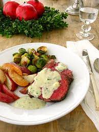 Grand & gracious menu for a classic dinner, serve a succulent beef tenderloin paired with baby blue salad, creamy soup, yeast rolls, and more. Holiday Dinner Party Menu Beef Tenderloin Truffled Potatoes Brussels Sprouts Dinner Party Menu Dinner Menu Holiday Dinner
