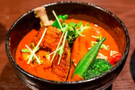 Soup curry, on the other hand, is essentially a curry flavored soup served with a bit of meat and a huge variety of vegetables. Soup Curry Yellow Hokkaido Guide