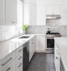 By bringing the backsplash from the countertops to the ceiling, the designer created a sizable accent wall that appears as if it was carved right out of the earth. 75 Beautiful White Kitchen Pictures Ideas July 2021 Houzz