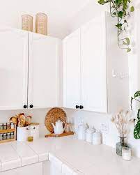 decorate the top of your kitchen cabinets