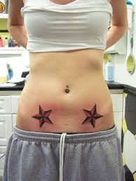 It a form of expression and communication. Black And Red Nautical Star Tattoos On Girl Stomach