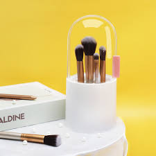 white plastic makeup brush holder