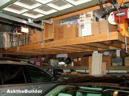 By building a simple platform and then attaching it to. Overhead Garage Storage